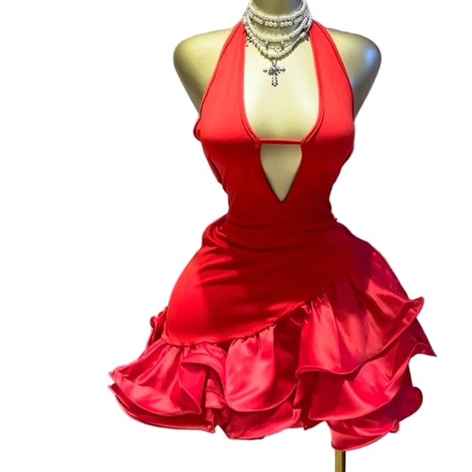 Red dress on a mannequin with jewelry, against a light background